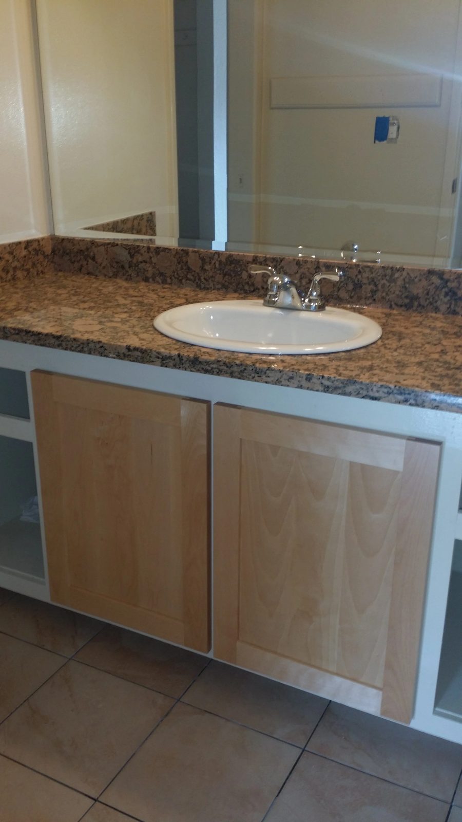 Bathroom upgrade with new mirror and vanity