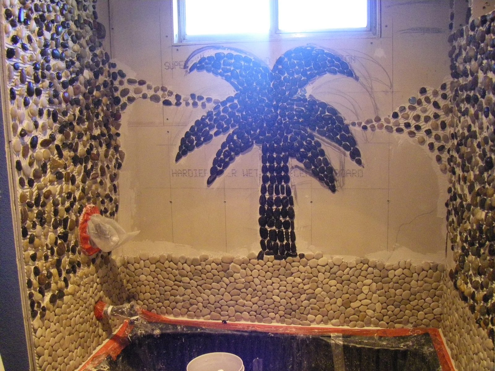 Bathroom remodel showing mirror and sink upgrade
