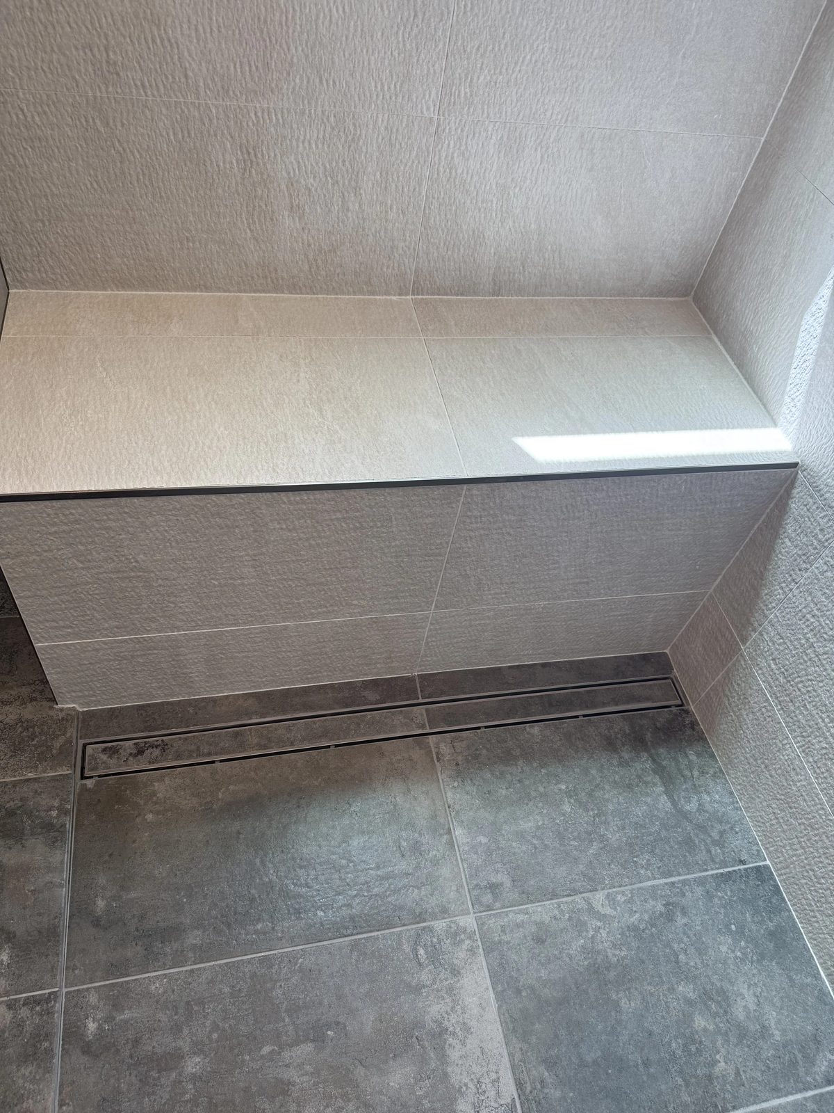 Elegant bathroom renovation with stone accents