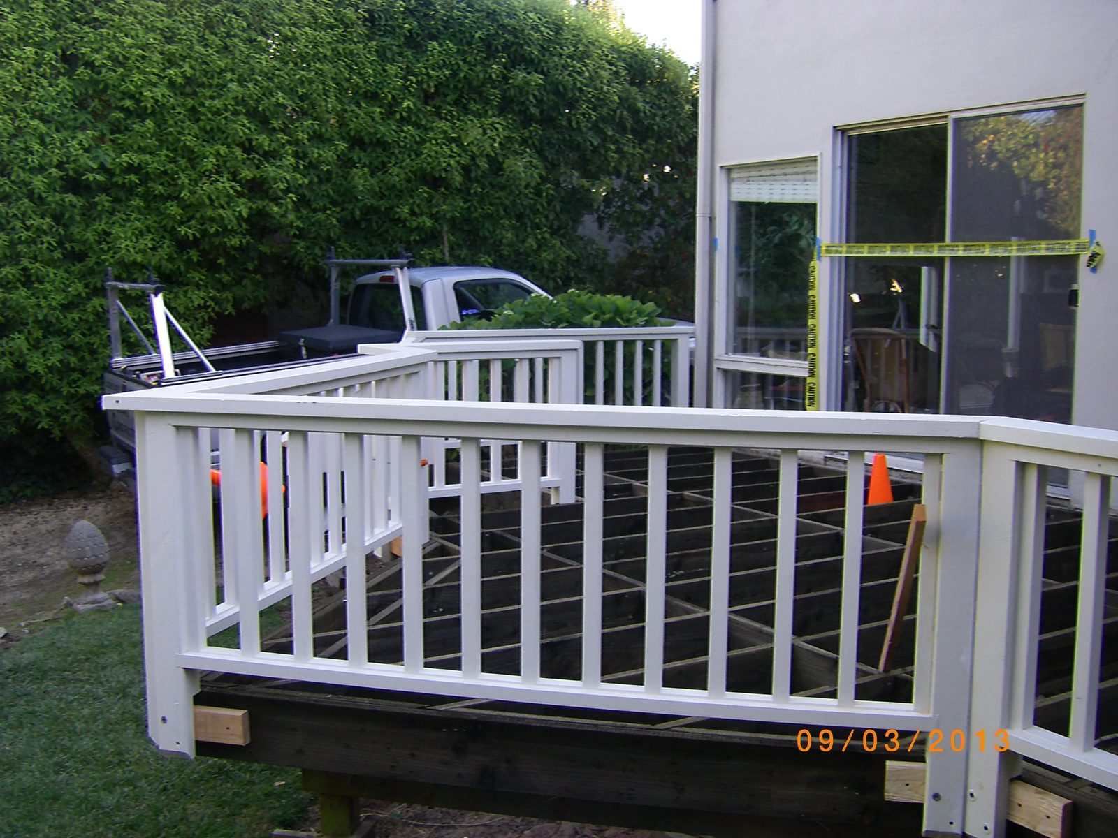 Multi-level deck design for sloped yard