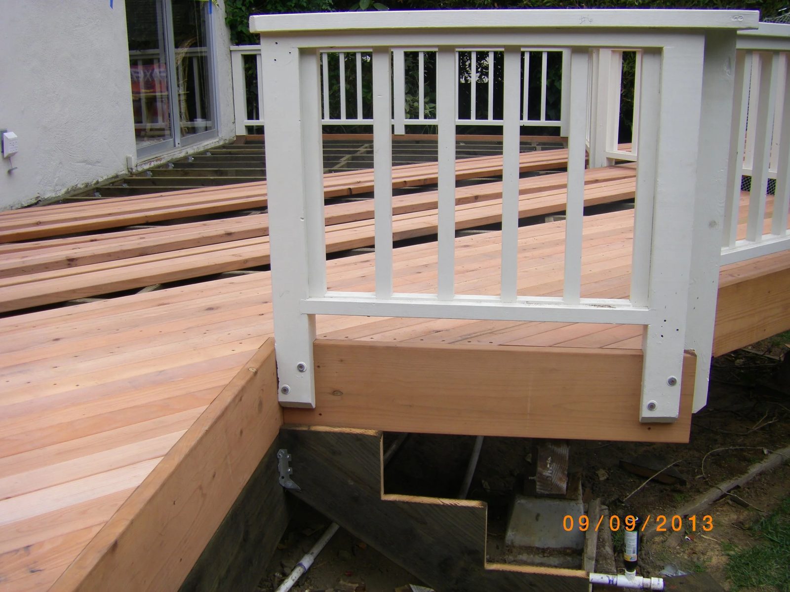 Outdoor living space with new deck and seating area