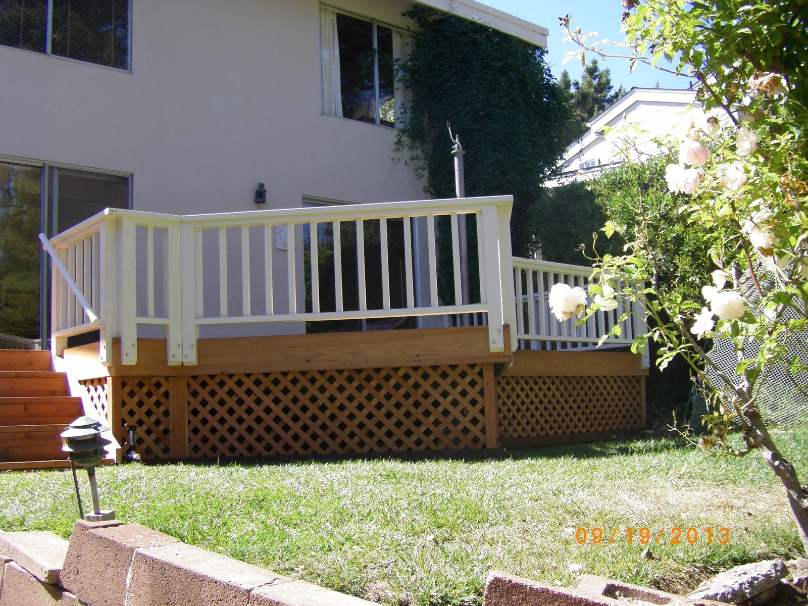 Completed deck project by Aboveboard Construction Inc