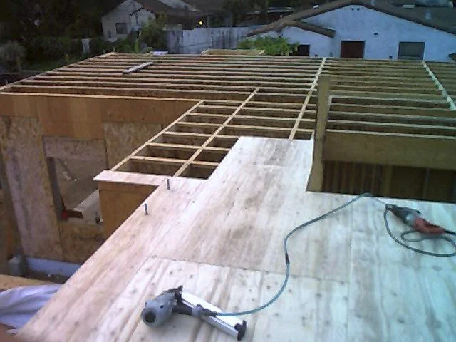 Wall sheathing over framed structure
