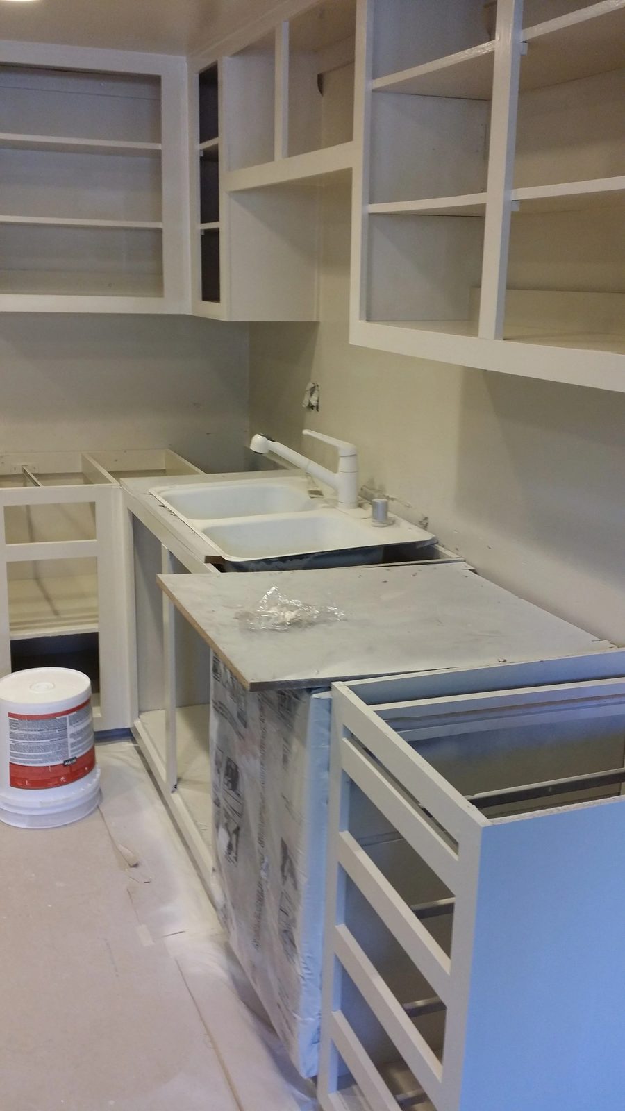 Completed kitchen showing new appliance installation