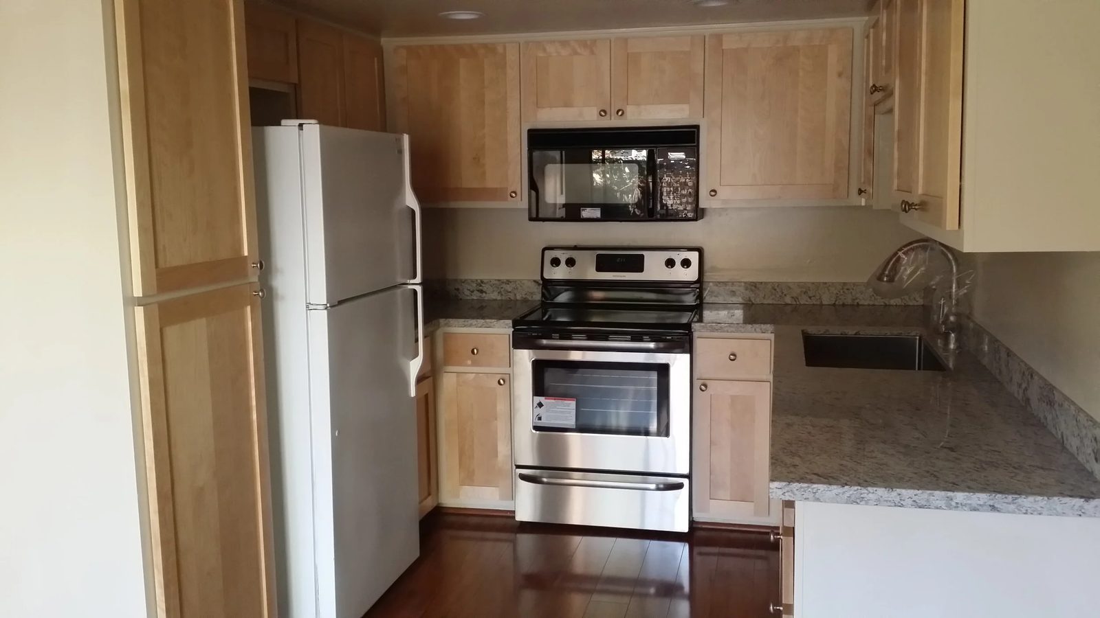Kitchen remodel featuring updated appliances and fixtures